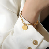 Armband van roestvrij staal met goudkleurige afwerking, medaillon "Forever", model Mathilde