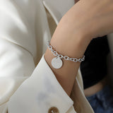 Armband van roestvrij staal met goudkleurige afwerking, medaillon "Forever", model Mathilde