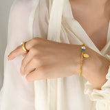 Goudkleurige roestvrijstalen kralenarmband met zoetwaterparel en kristal, model Katy